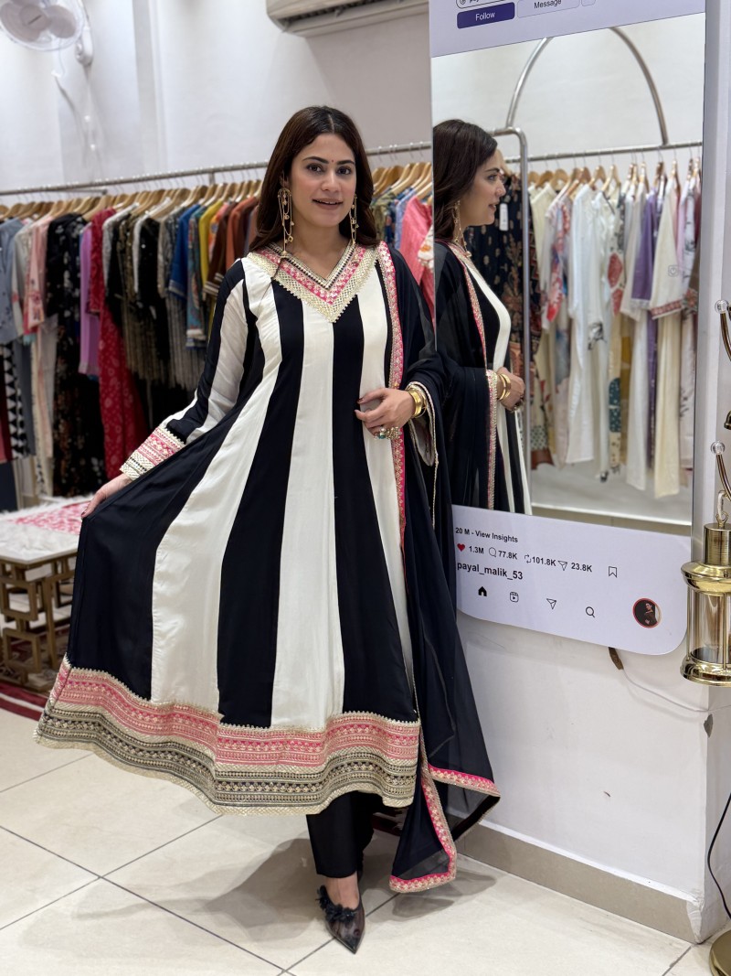 Elegant Black and Ivory/Cream, enhanced with beautiful Rani Pink and antique-gold border detailing.